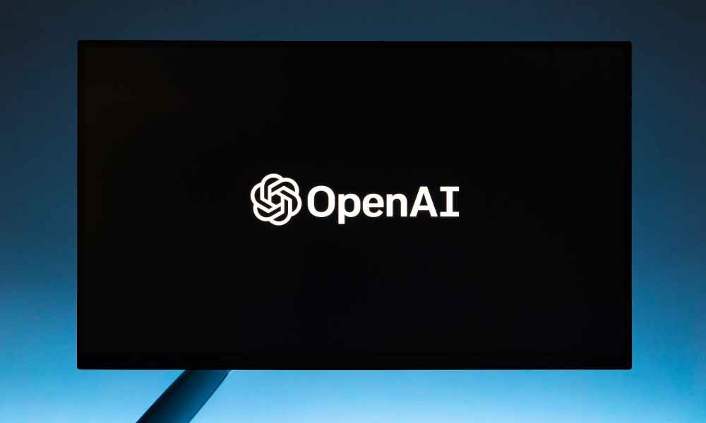 monitor screen with openai logo on black background
